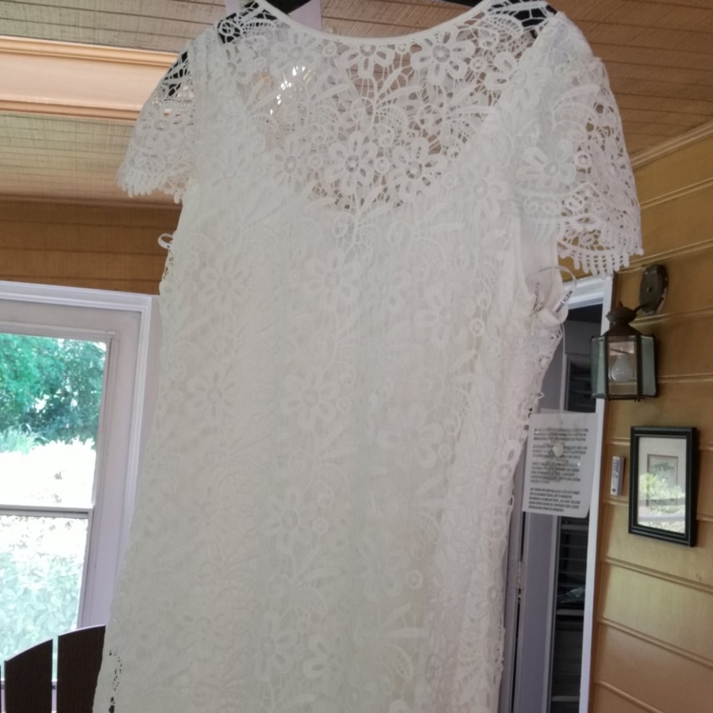 Eloquent white dress.  Great for party or wedding.